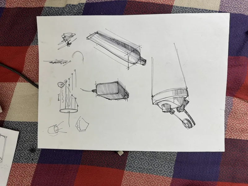 Line studies of small everyday objects on a sheet of paper